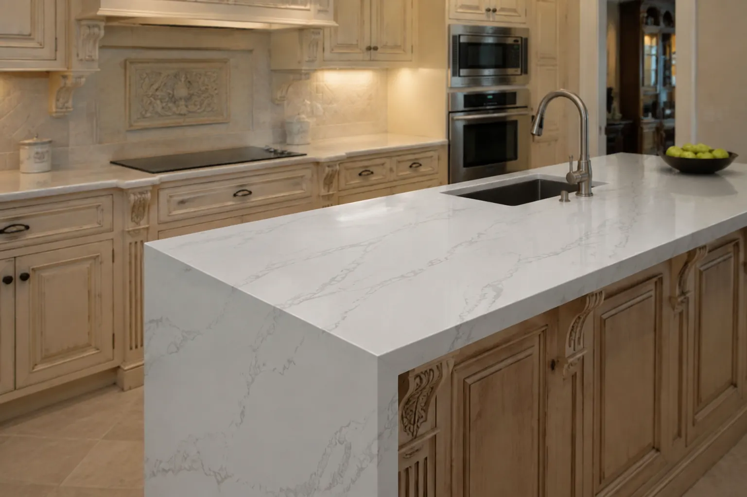 Kitchen in Oakville with Carrara White quartz counters and a waterfall island